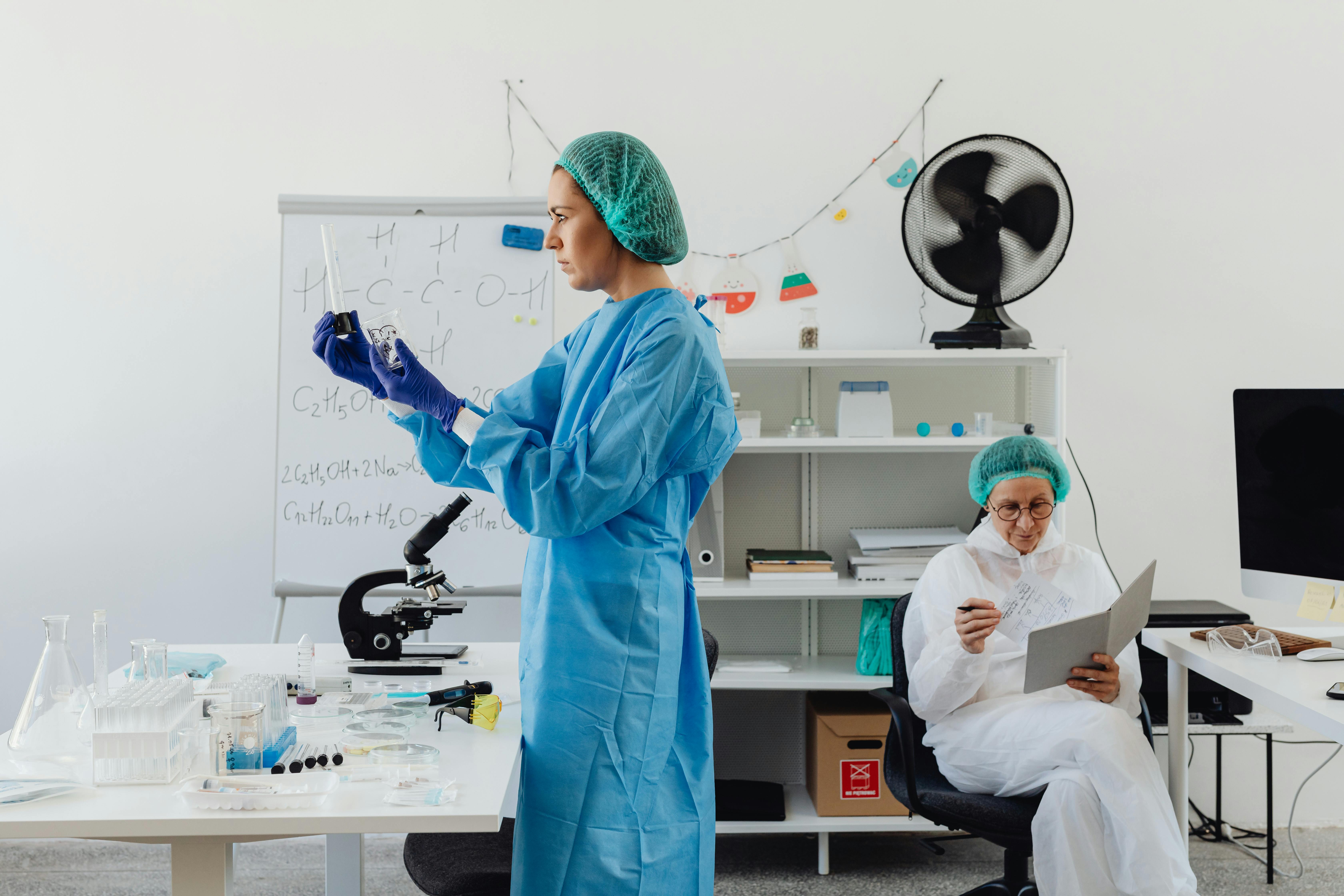 Pharmaceutical laboratory professionals working in a clinical environment
